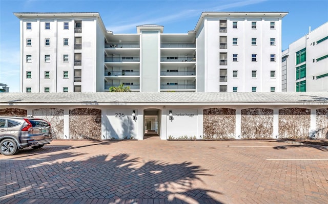 226 Golden Gate Pt Unit 64, Sarasota, FL 34236 - view of property featuring uncovered parking