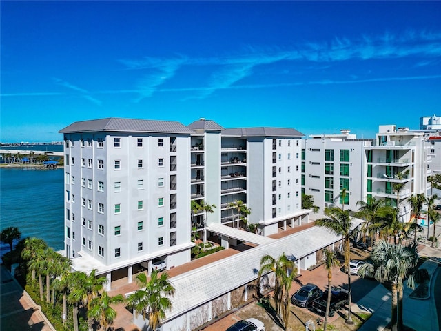 226 Golden Gate Pt Unit 64, Sarasota, FL 34236 - view of building exterior with a water view