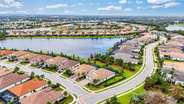 bird's eye view with a water view and a residential view