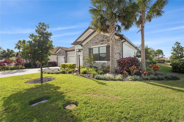 view of front of house with an attached garage, stone siding, concrete driveway, stucco siding, and a front lawn