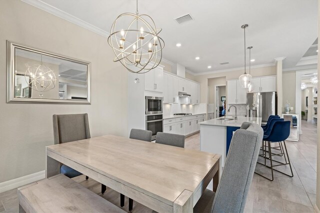 dining area featuring visible vents, crown molding, baseboards, and an inviting chandelier