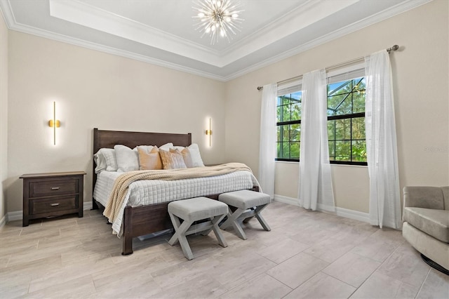 bedroom with baseboards, a tray ceiling, a chandelier, and crown molding