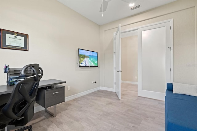 office area featuring visible vents, ceiling fan, and baseboards