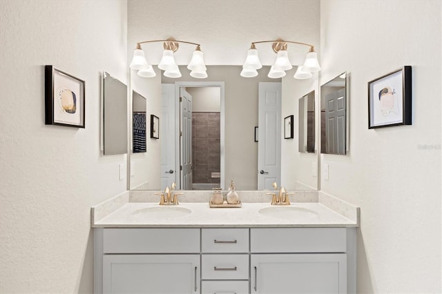 bathroom with double vanity and a sink