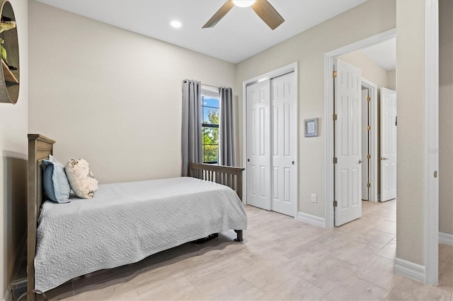 bedroom with a closet, ceiling fan, and baseboards