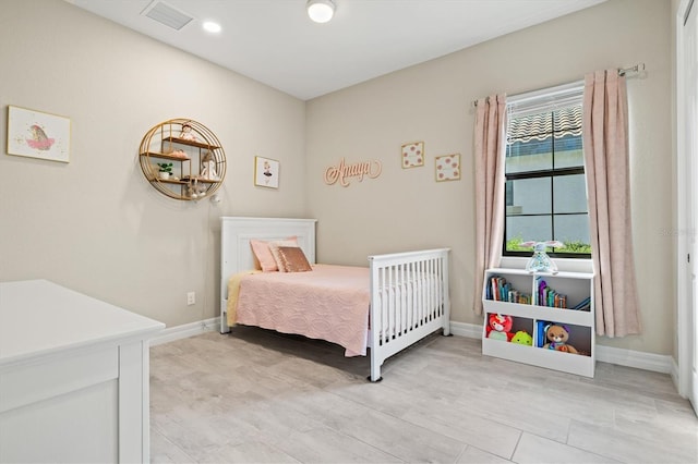 bedroom with recessed lighting, visible vents, and baseboards