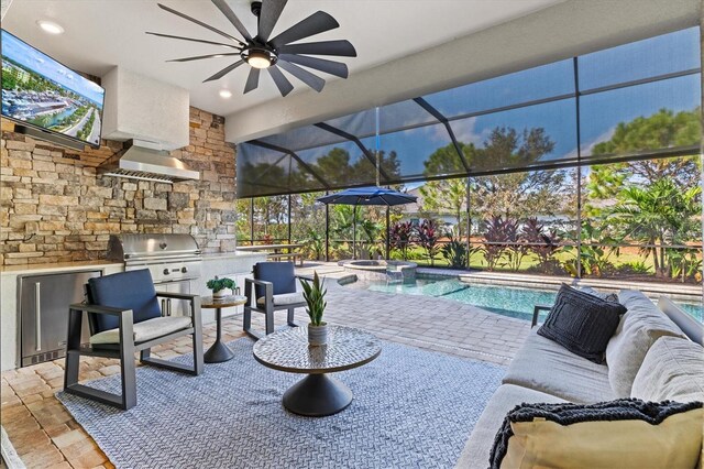 view of patio / terrace featuring a ceiling fan, grilling area, a lanai, exterior kitchen, and a pool with connected hot tub