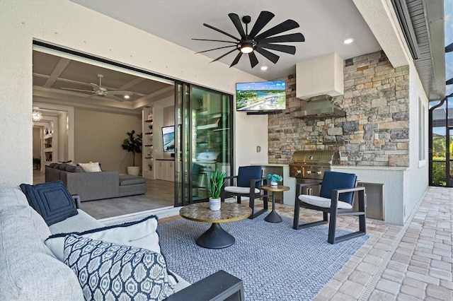 view of patio featuring a ceiling fan, a grill, an outdoor kitchen, and an outdoor hangout area