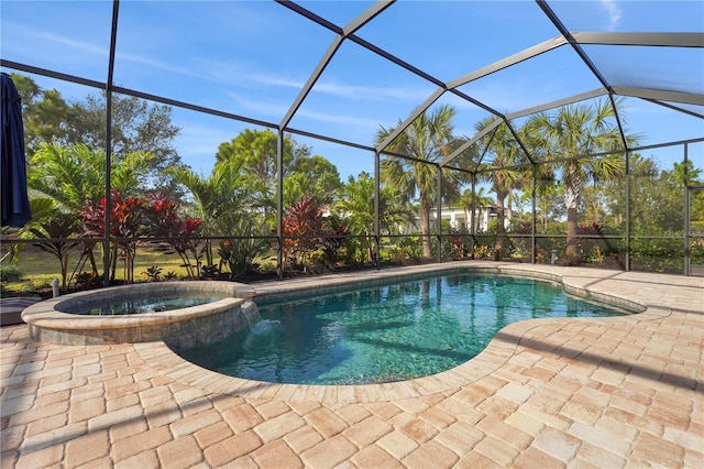 view of swimming pool featuring a lanai, a patio area, and a pool with connected hot tub