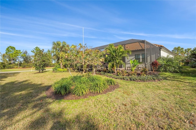 view of yard featuring a lanai