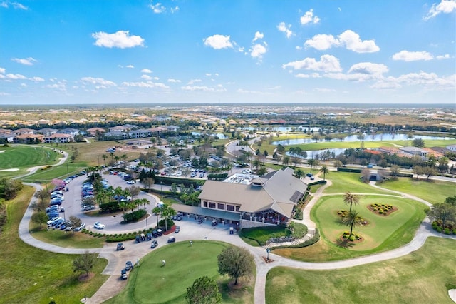 bird's eye view featuring view of golf course and a water view