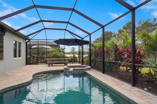 view of swimming pool with a pool with connected hot tub, a lanai, and a patio