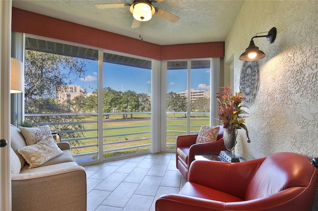 sunroom / solarium with ceiling fan and a wealth of natural light