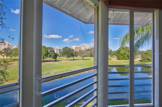 entryway featuring a water view and a healthy amount of sunlight