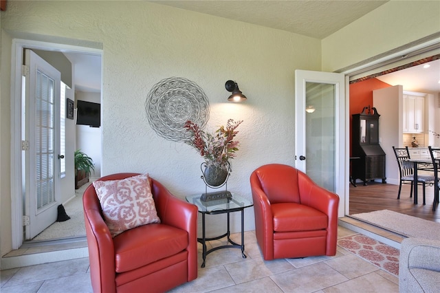 living area with light tile patterned floors