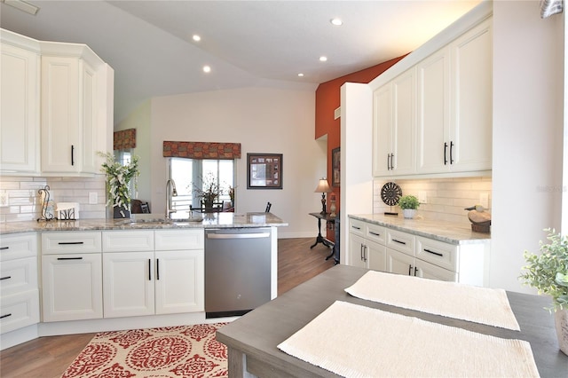 kitchen featuring light stone countertops, white cabinets, sink, and dishwasher