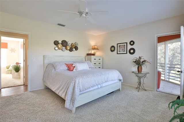 bedroom featuring access to exterior, ceiling fan, and carpet