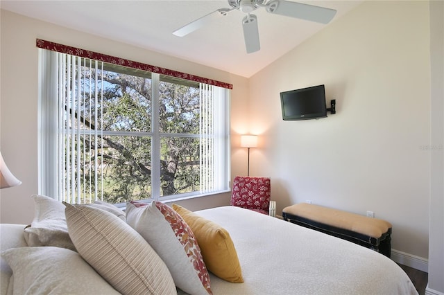 bedroom featuring lofted ceiling and ceiling fan