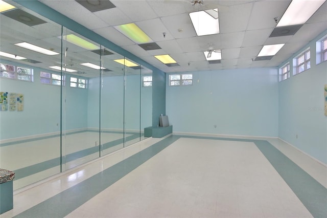 unfurnished room featuring a paneled ceiling