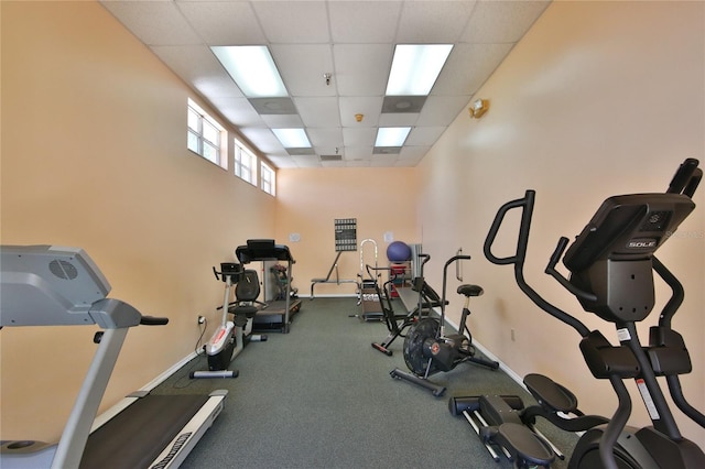 exercise room with a paneled ceiling