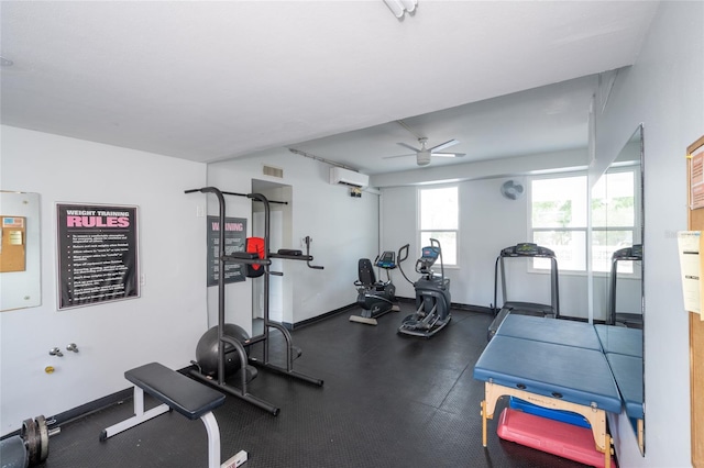 workout area with ceiling fan and a wall unit AC