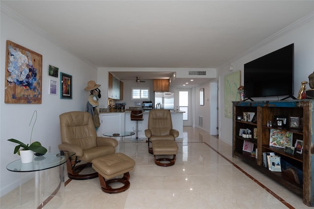 living room featuring crown molding