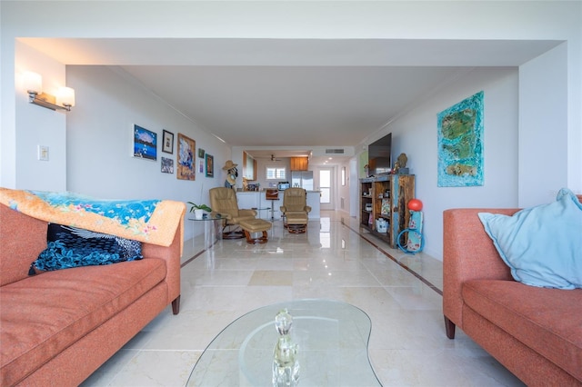 tiled living room with crown molding