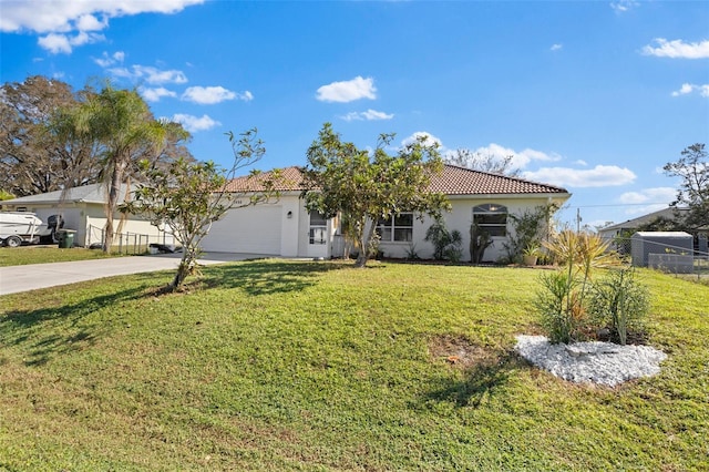 view of front of property with a front lawn and a garage