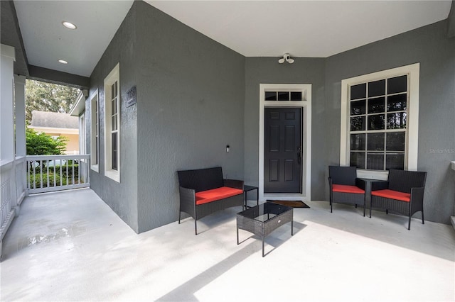 view of exterior entry featuring stucco siding