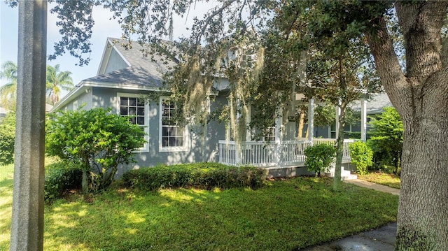 view of side of home featuring a lawn