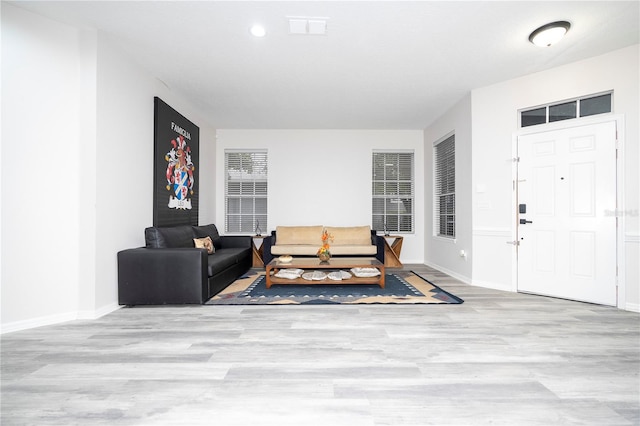 living room with light hardwood / wood-style floors