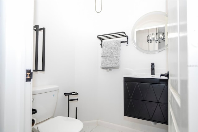 bathroom featuring vanity, toilet, and tile patterned floors