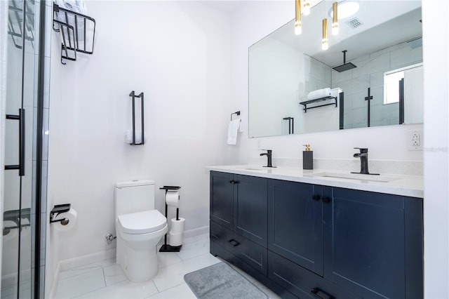 bathroom with a shower with door, vanity, and toilet