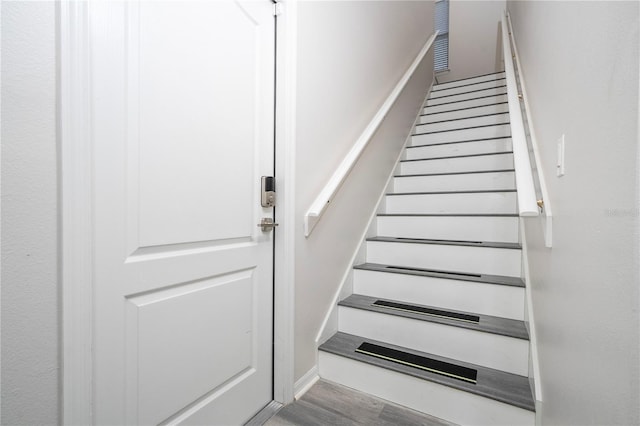 staircase featuring hardwood / wood-style floors