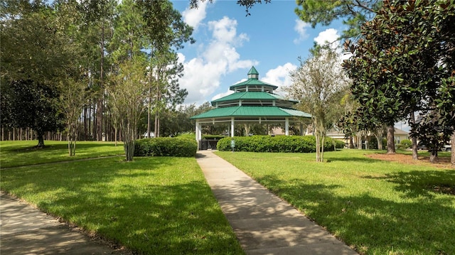 surrounding community featuring a gazebo and a lawn