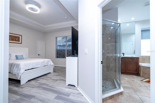 bedroom with recessed lighting, baseboards, ensuite bathroom, light wood-type flooring, and ornamental molding