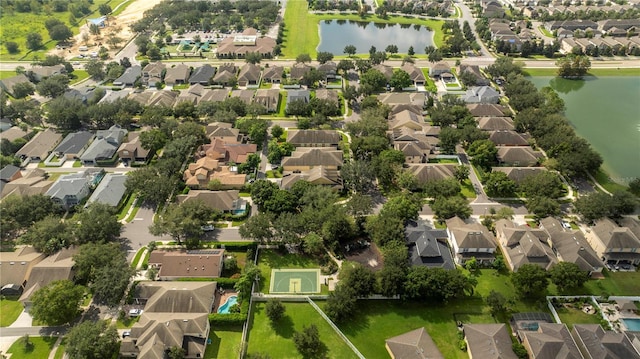 birds eye view of property featuring a water view and a residential view