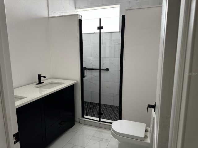 full bath with a sink, double vanity, toilet, a marble finish shower, and marble finish floor