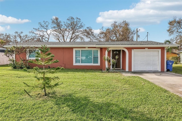 single story home with a garage and a front lawn