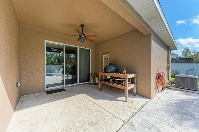 view of patio featuring central AC unit and ceiling fan