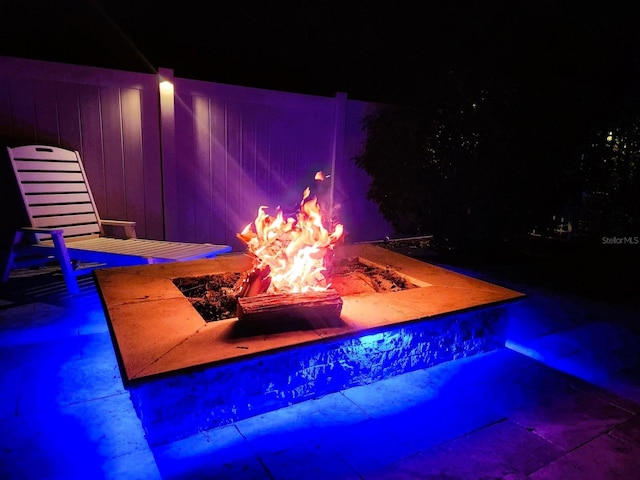 pool at twilight with a fire pit