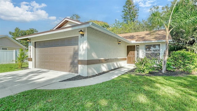 ranch-style home featuring a garage and a front yard