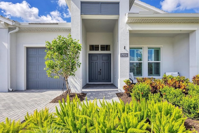 doorway to property featuring a garage