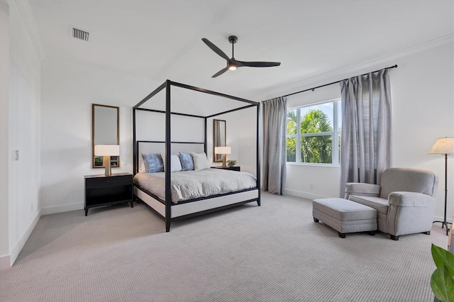 bedroom featuring ceiling fan, crown molding, and light colored carpet