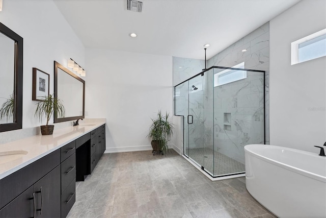 bathroom featuring vanity and shower with separate bathtub