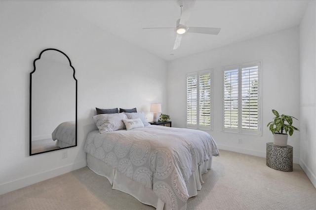 bedroom featuring ceiling fan and light colored carpet