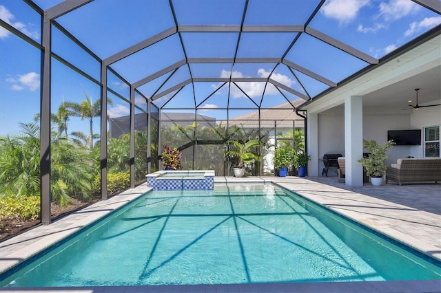 view of pool featuring ceiling fan, an outdoor living space, a lanai, a patio area, and an in ground hot tub