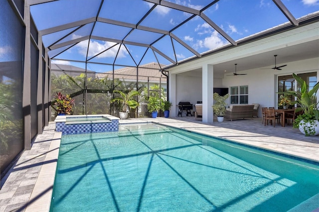 view of swimming pool featuring a patio area, ceiling fan, an in ground hot tub, and glass enclosure