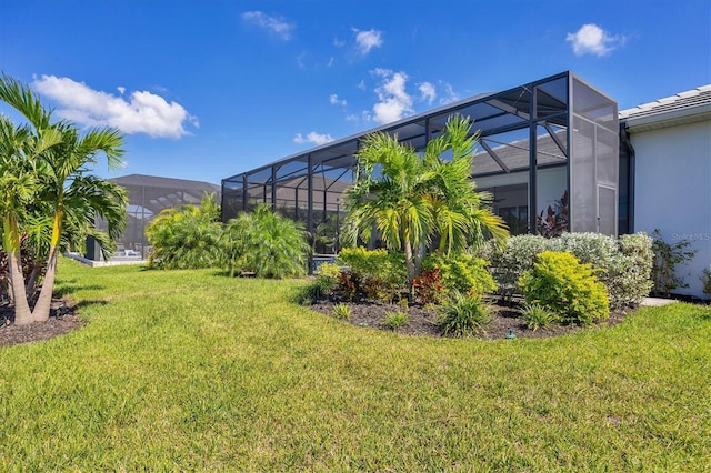 view of yard with glass enclosure