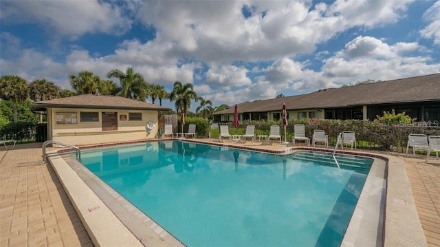 view of swimming pool featuring a patio area